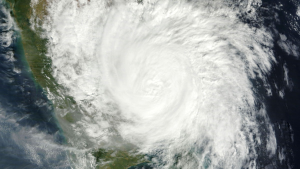 A bomb cyclone is a large mid-latitude storm that forms when a storm’s central pressure drops.