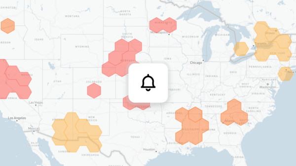 Alerts on a map — hexagonal alert regions across the U.S. by severity, with a single notification bell