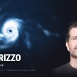 Jason Rizzo, Chief Revenue Officer of Tomorrow.io, beside a microwave satellite scan of Hurricane Polo's eye