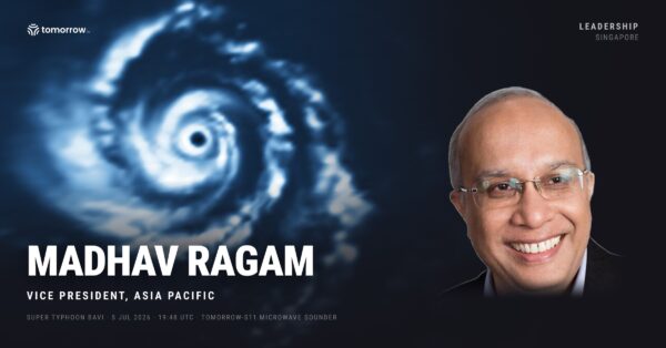 Madhav Ragam, Vice President, Asia Pacific at Tomorrow.io, beside a microwave satellite scan of Super Typhoon Bavi's eye