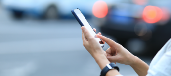 Ride-hailing Operations Person using mobile phone