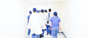health-management-hp Doctors walking down hall