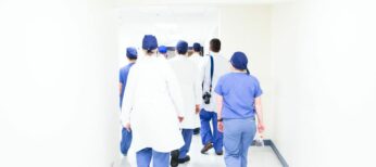 Doctors walking down hall