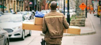 Delivery person carrying packages